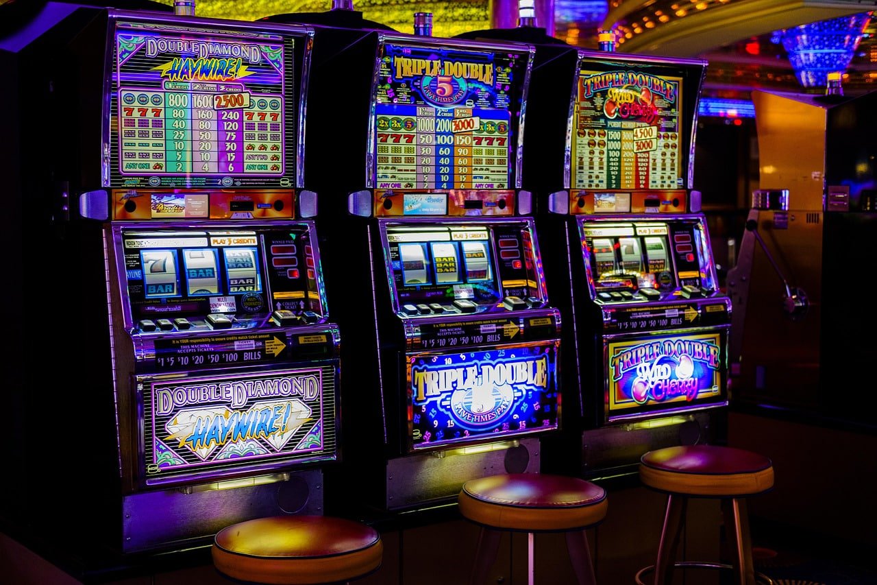 Online casino slot and live dealer games on mobile device screen